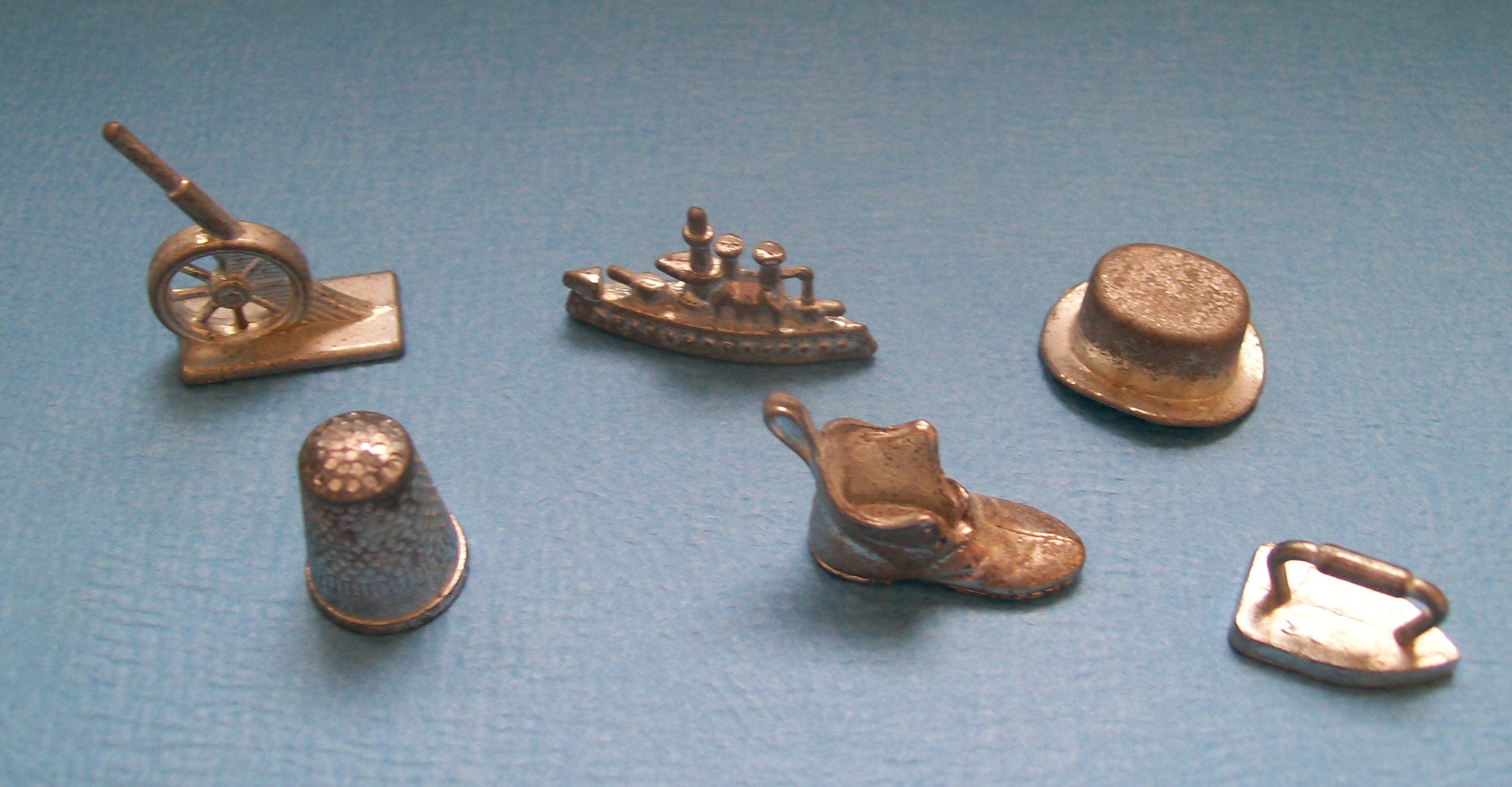 image of original monopoly pieces