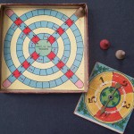 old 1900's parker brothers game board and pieces