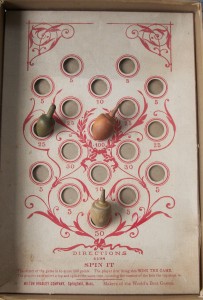 antique spinning tops and old Milton bradley game board